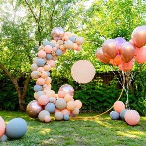 Photozone holiday with balloons on the background of greenery in the garden in the backyard